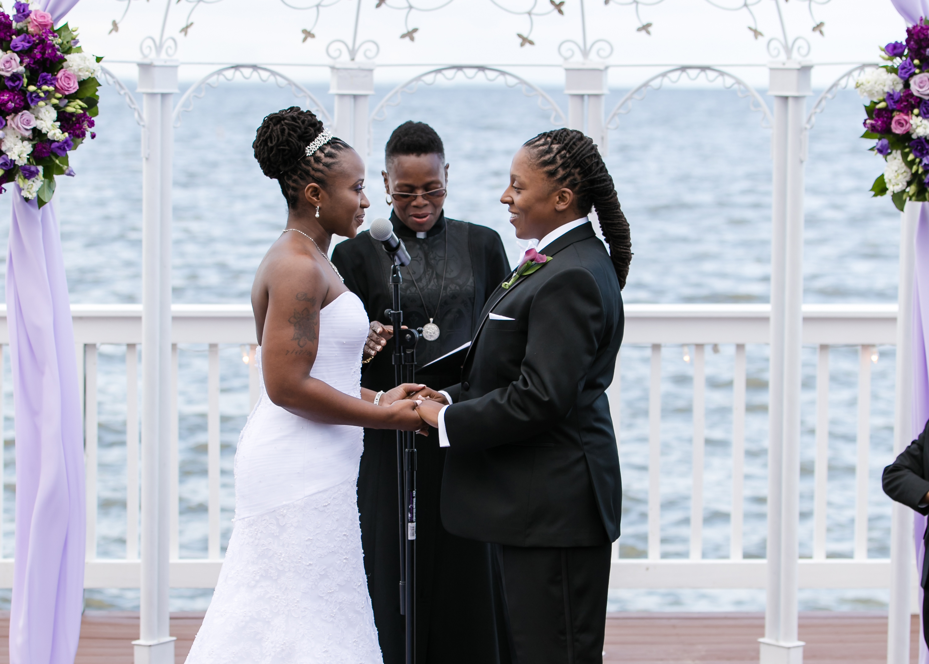 Same-sex couple’s wedding at Celebrations at the Bay, officiated by award-winning DC wedding officiant Starlene.
