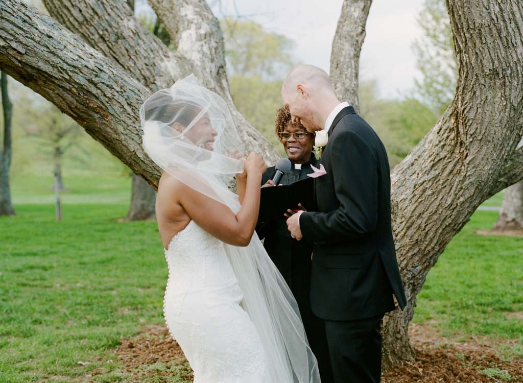 Biracial couple’s civil ceremony with officiant Starlene at a Virginia wedding venue, celebrating love and unity.